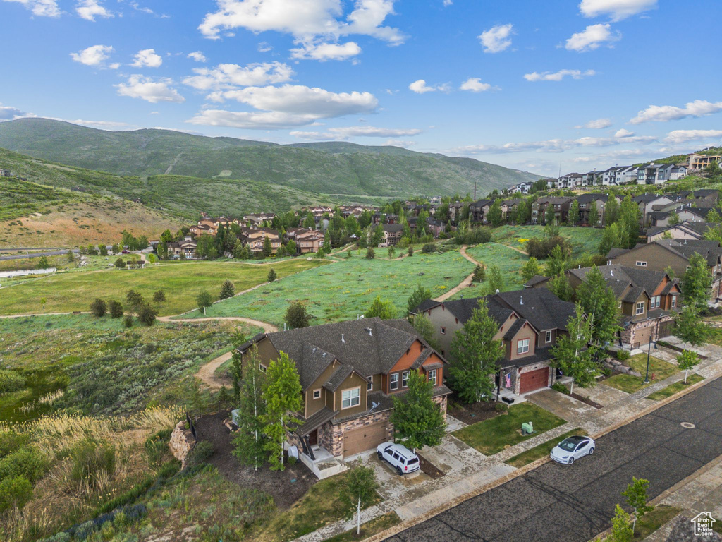 View of property location featuring nearby suburban area and mountains