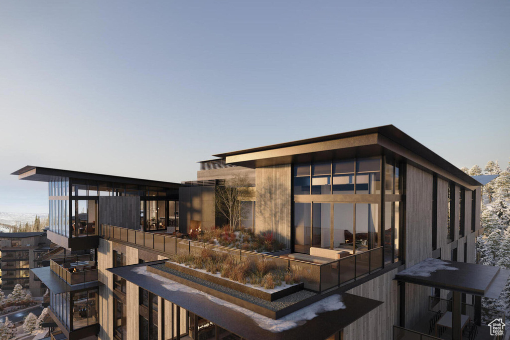 View of back of house at dusk