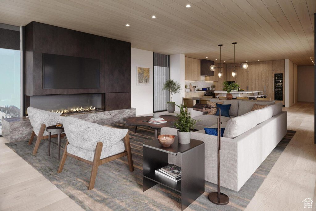 Living area featuring wood finished floors, wooden ceiling, recessed lighting, and a large fireplace
