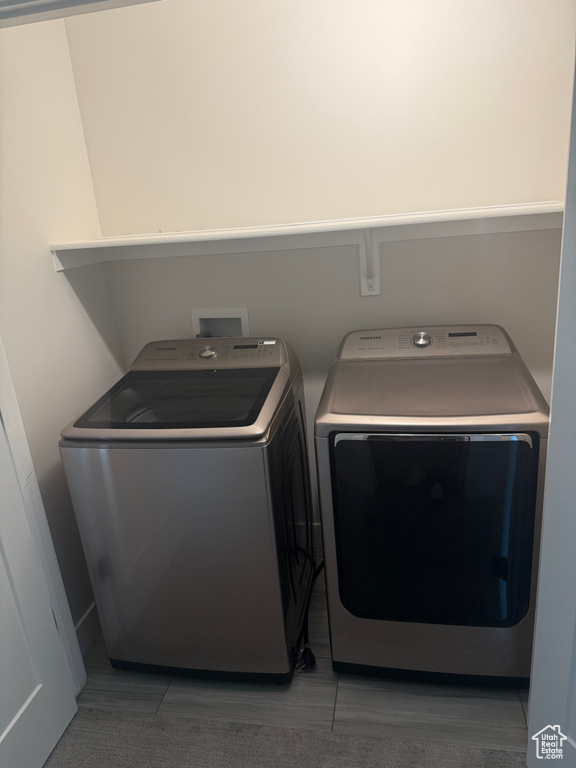 Laundry room with washing machine and clothes dryer