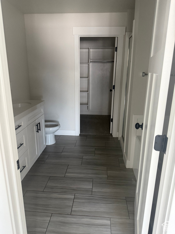 Bathroom featuring vanity and toilet