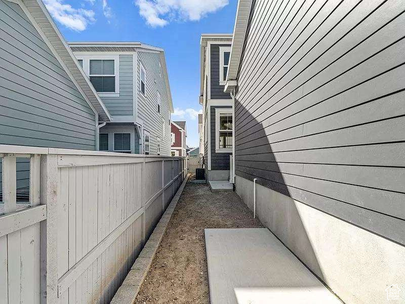 View of home's exterior featuring a cooling unit