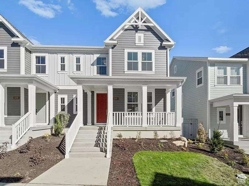 View of front of property with a porch and board and batten siding