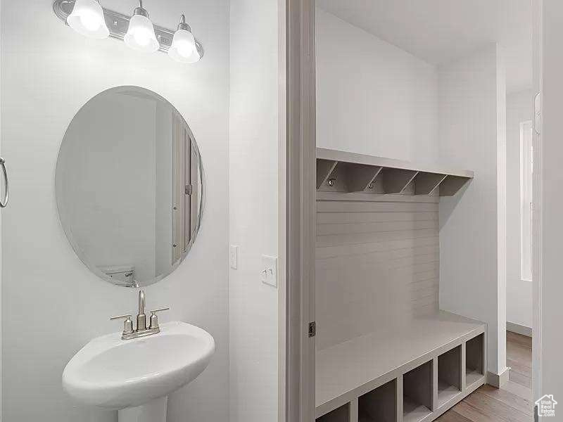 Bathroom with a sink and wood finished floors