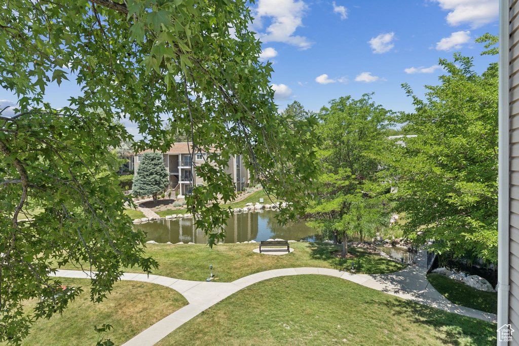View of green lawn with a water view