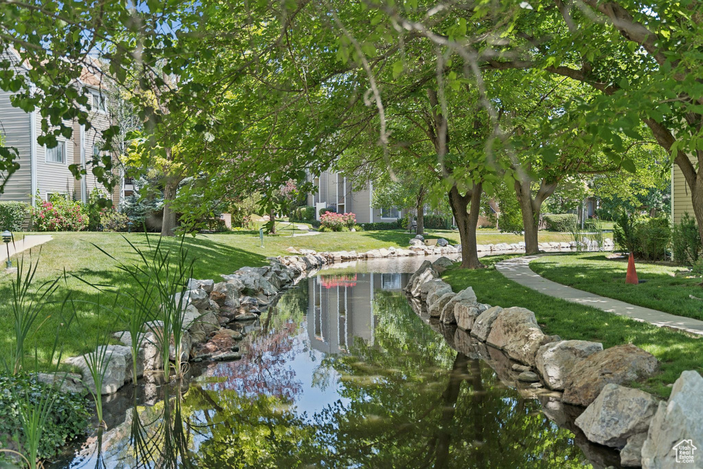 View of property's community featuring a yard