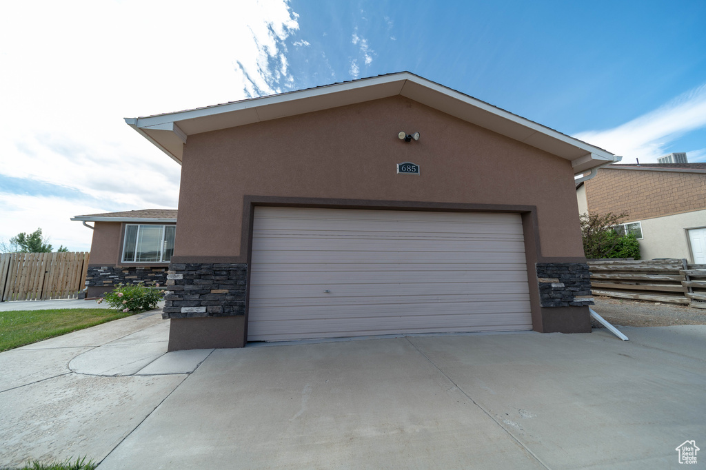 Garage with concrete driveway
