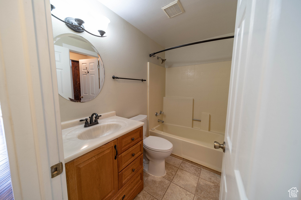 Bathroom featuring vanity and washtub / shower combination