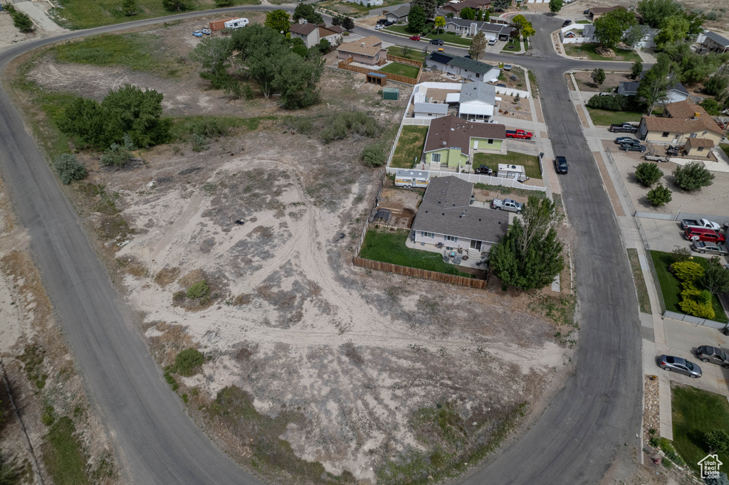 Aerial view of property's location with nearby suburban area
