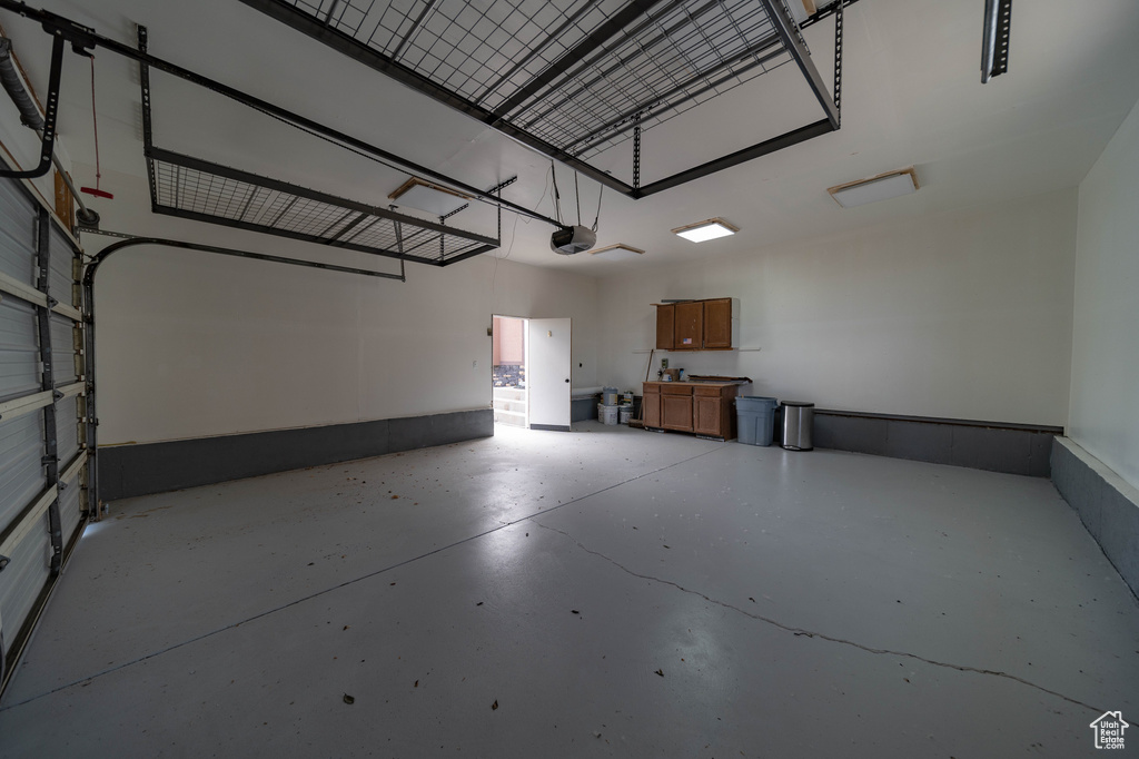 Garage featuring a garage door opener