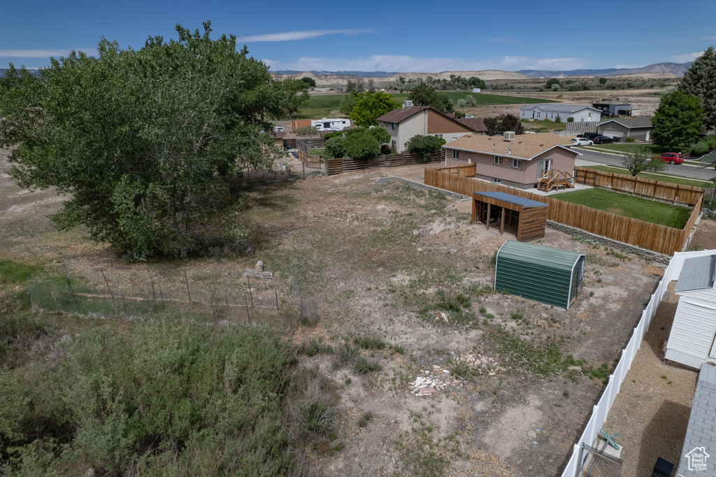 Aerial view of residential area featuring a mountainous background