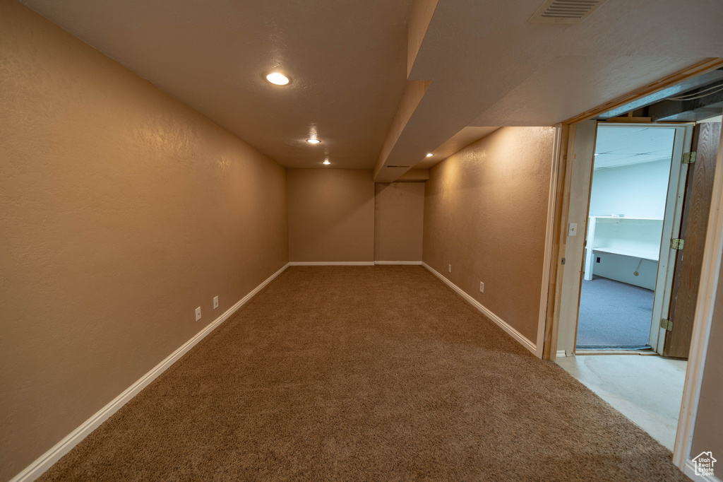 Finished basement featuring carpet flooring and recessed lighting