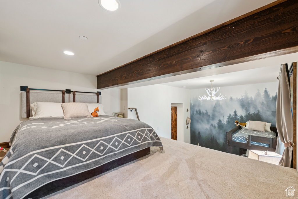 Bedroom with a chandelier and recessed lighting
