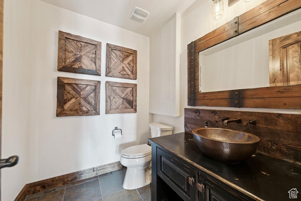 Bathroom featuring toilet and vanity