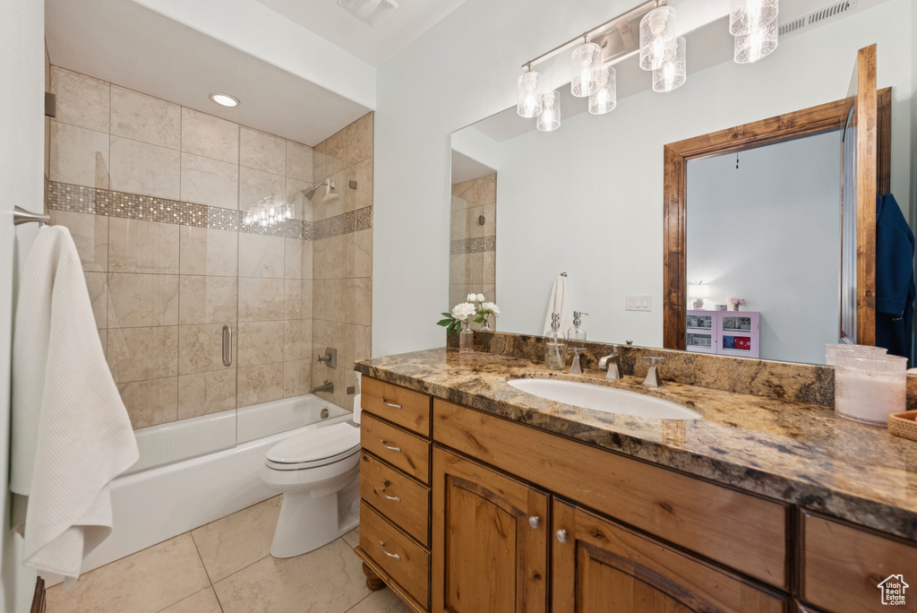 Bathroom featuring vanity, bathing tub / shower combination, and tile patterned floors