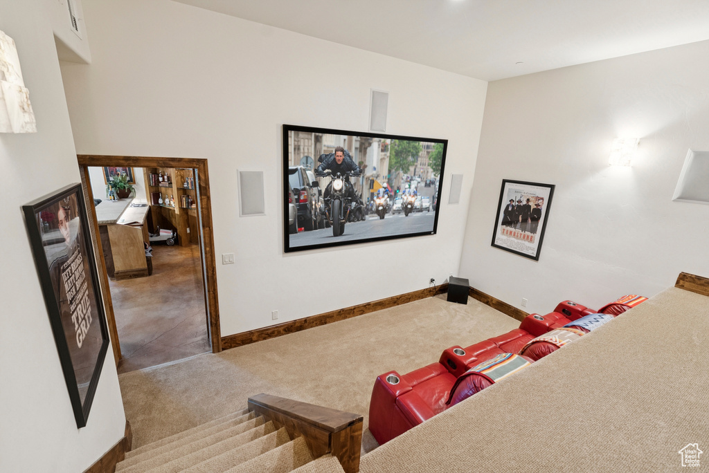 Home theater room featuring carpet floors and baseboards