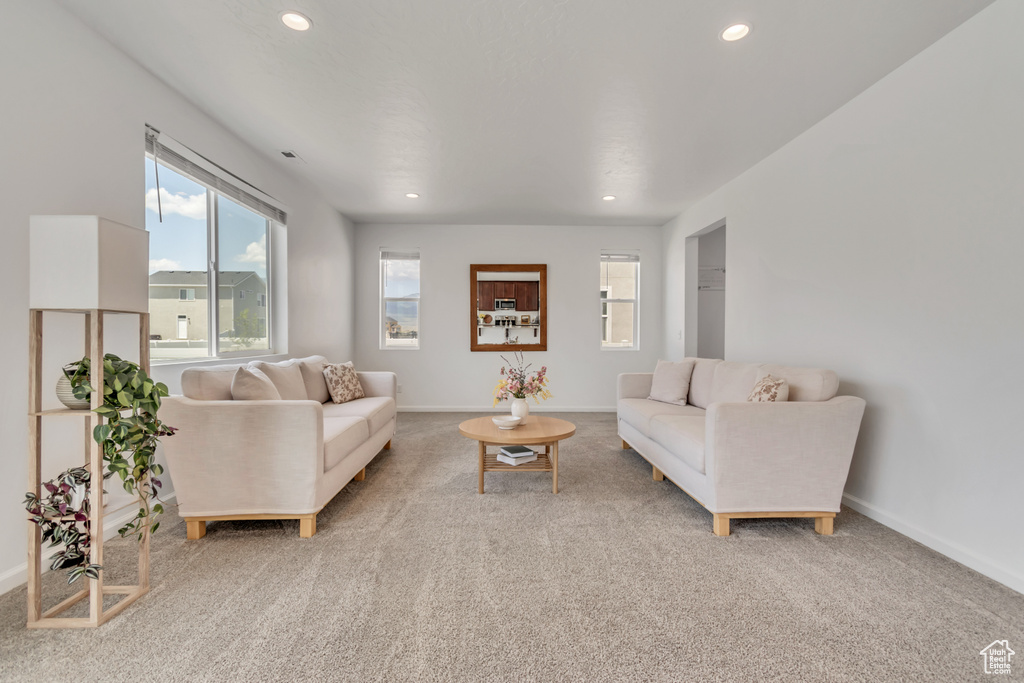 Living area featuring recessed lighting and carpet floors