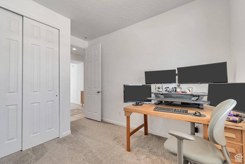 Office featuring light colored carpet and recessed lighting