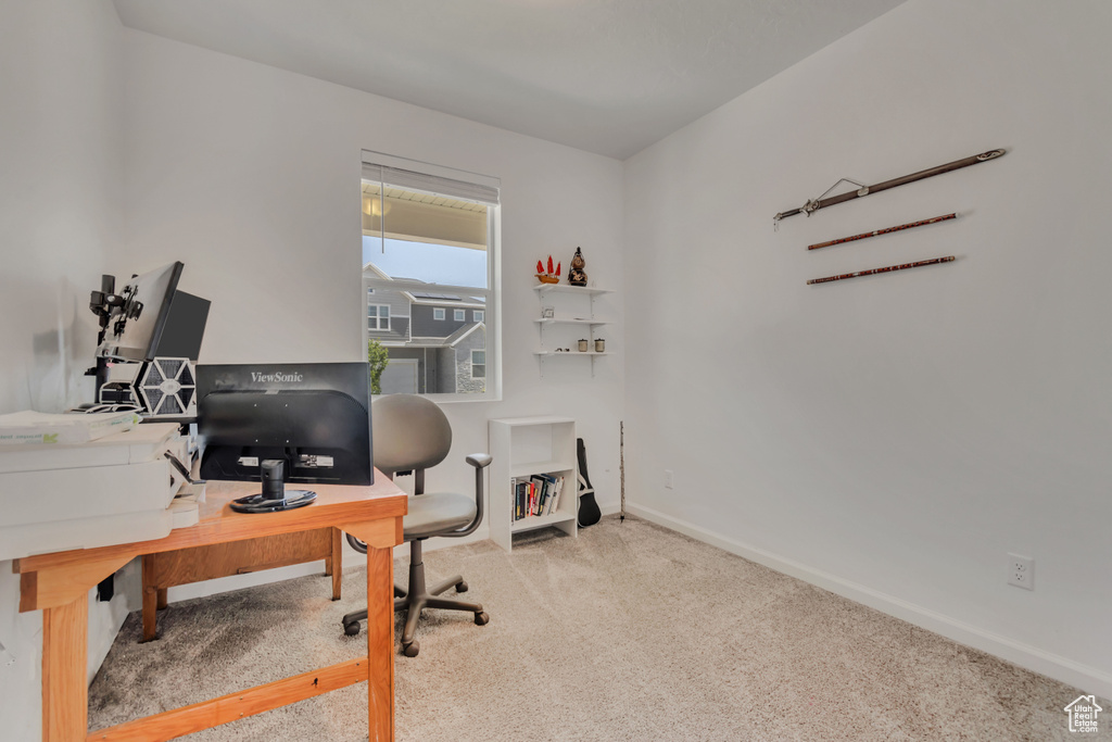Office area with carpet flooring and baseboards