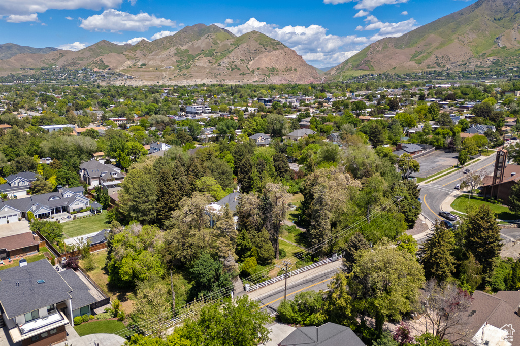 Aerial perspective of suburban area featuring a mountain backdrop