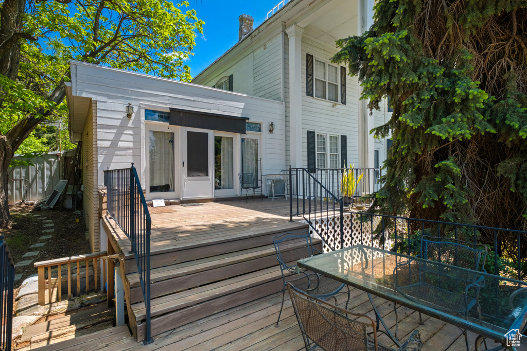 Wooden deck featuring outdoor dining area