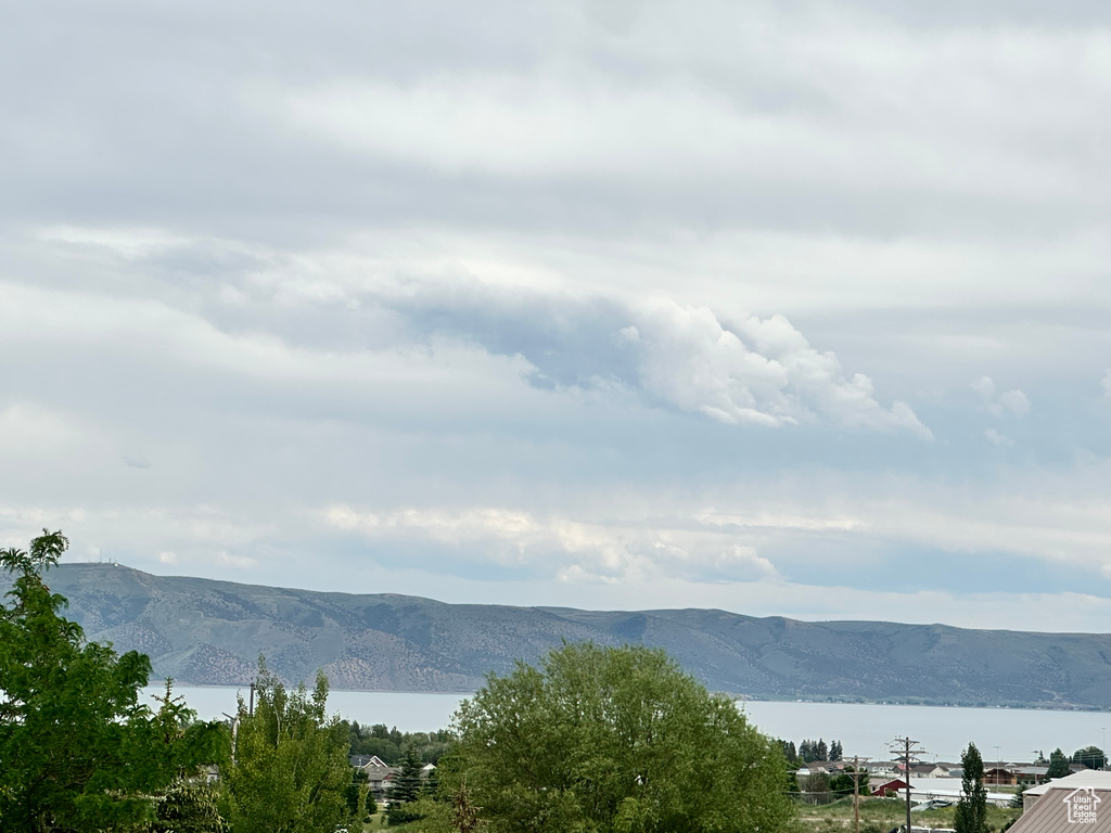 View of mountain backdrop with a nearby body of water
