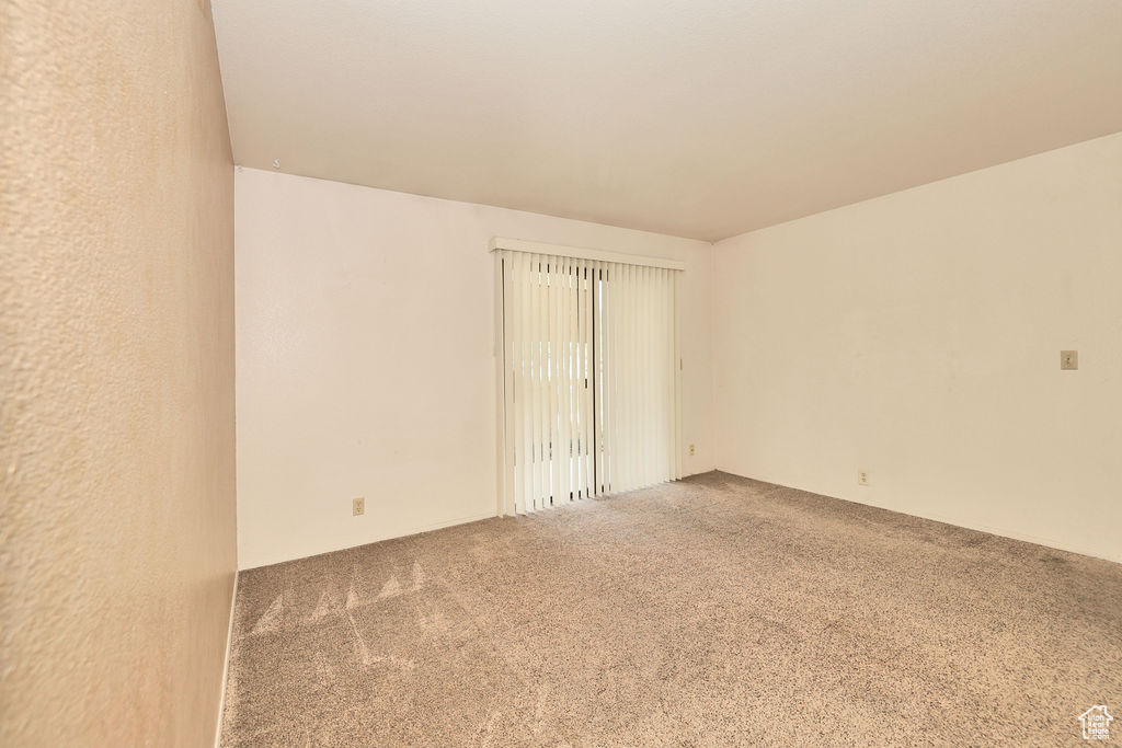 Unfurnished room with carpet floors