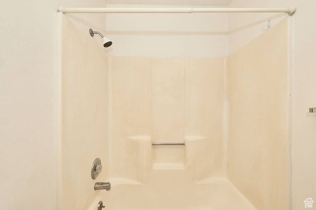 Full bath featuring shower / washtub combination