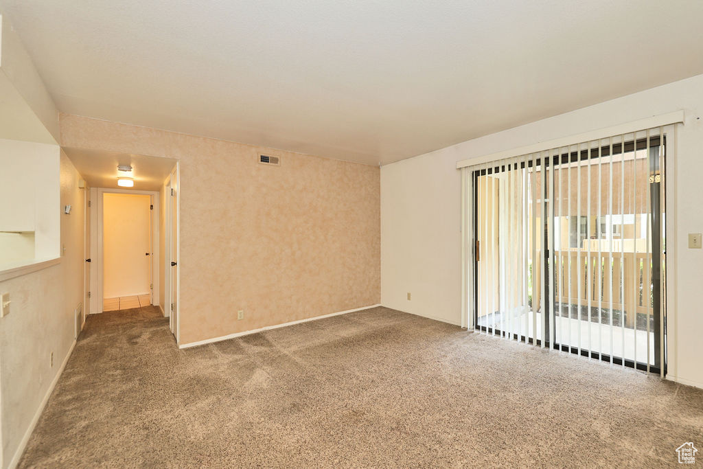Empty room with carpet floors
