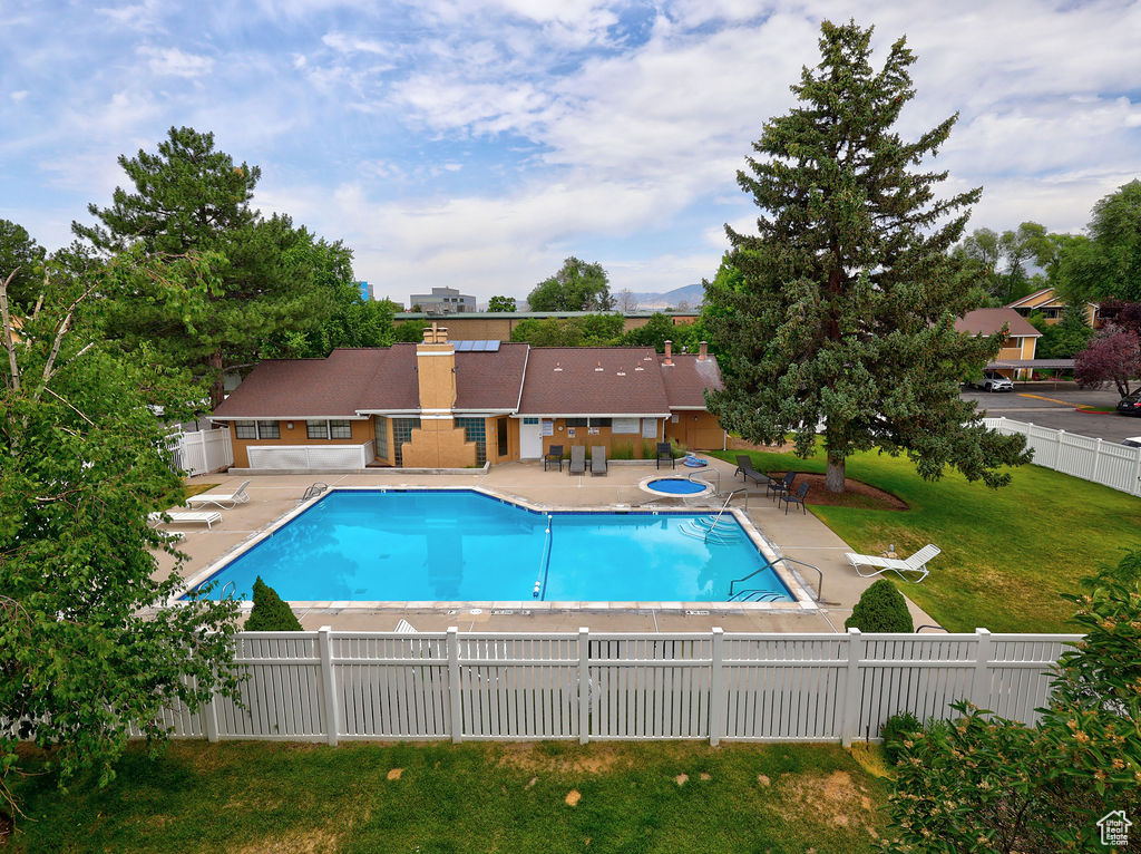Community pool with a patio area