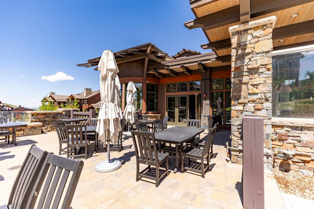 View of patio with french doors and outdoor dining area