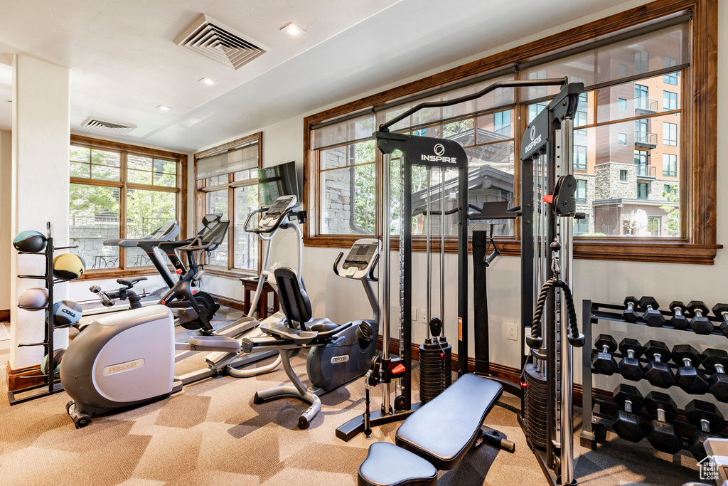Exercise room featuring carpet flooring and recessed lighting