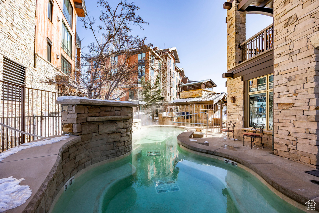 Community pool with a patio area