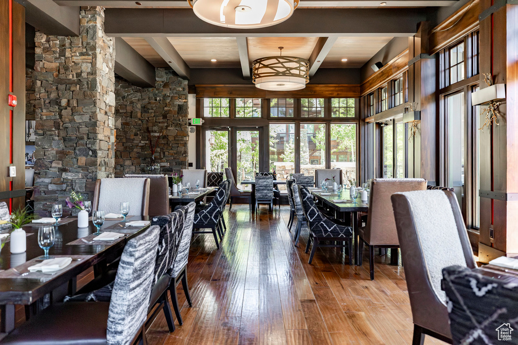 Dining area featuring hardwood / wood-style floors and beam ceiling