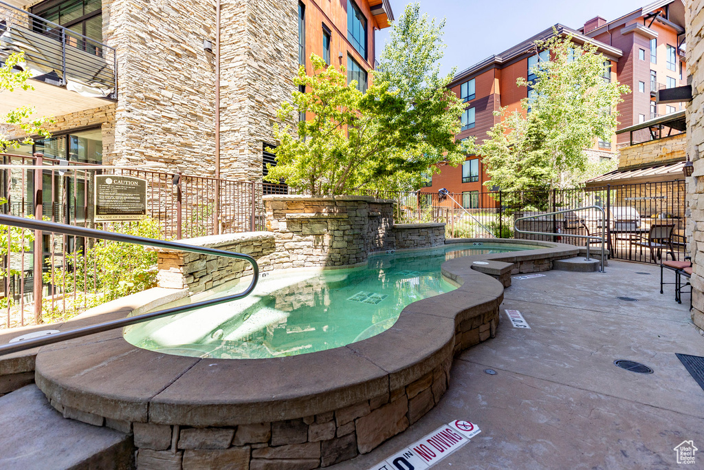 View of swimming pool with a swimming pool and a patio area
