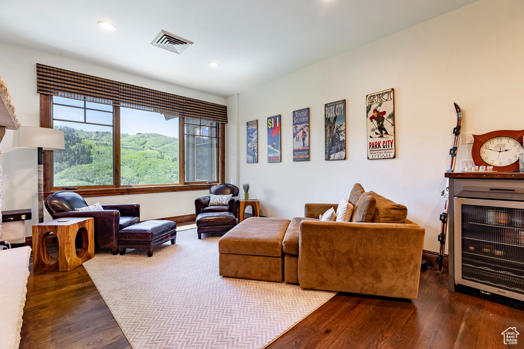 Living room with wood finished floors and recessed lighting