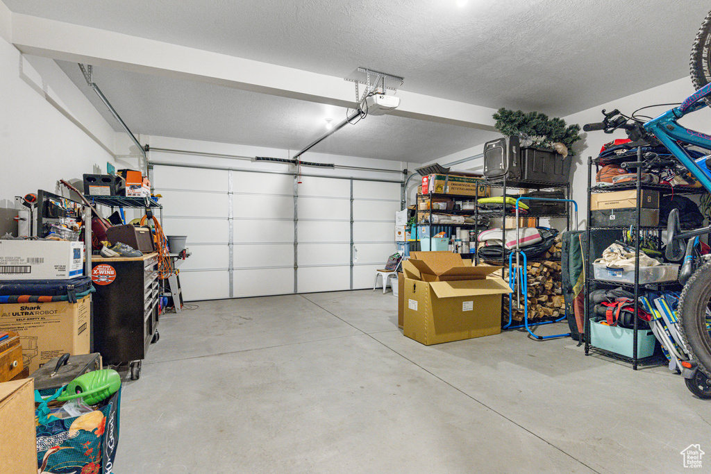 Garage featuring a garage door opener