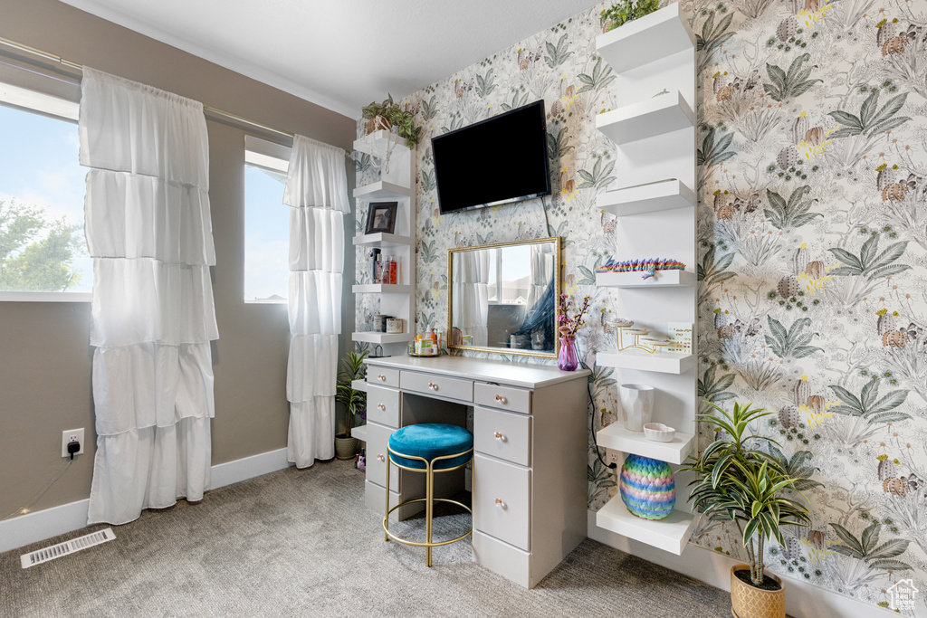 Office area featuring light colored carpet and wallpapered walls