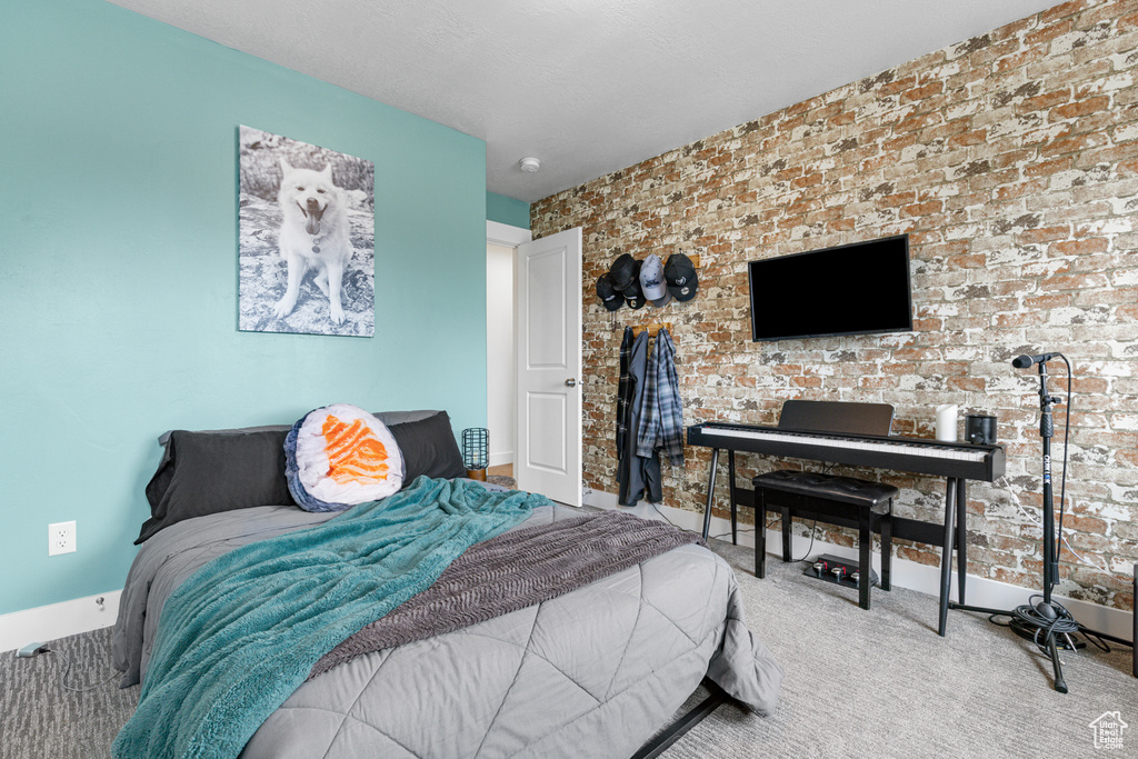 Carpeted bedroom with baseboards