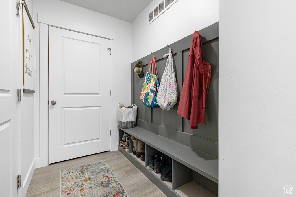 Mudroom featuring light wood-style floors