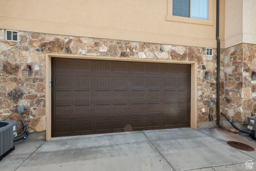 Garage featuring driveway