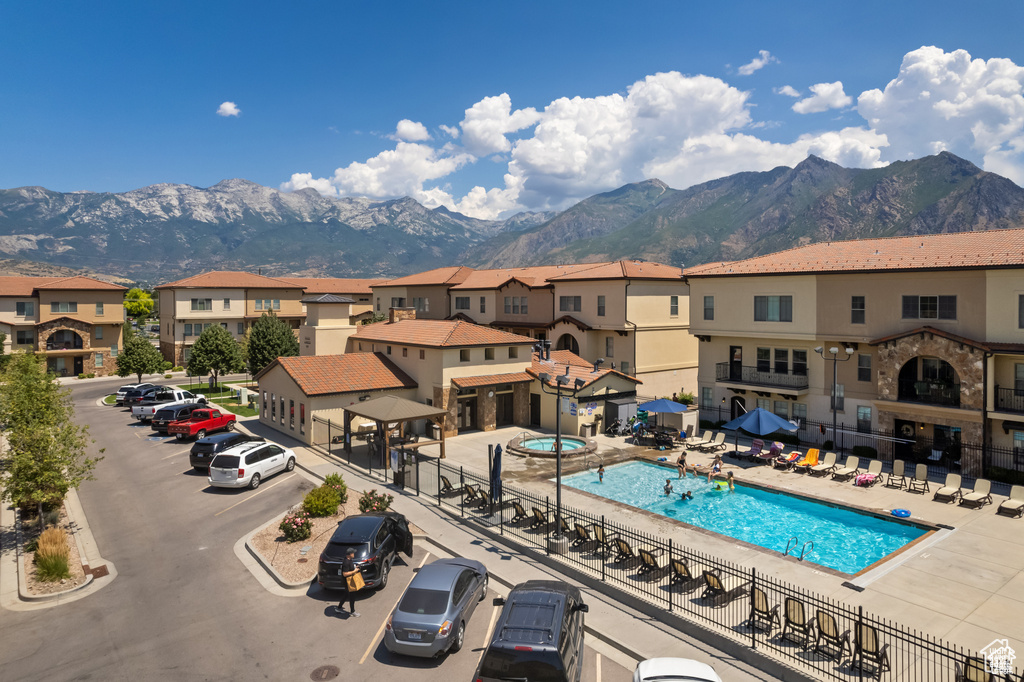 Community pool featuring a mountain view and a residential view