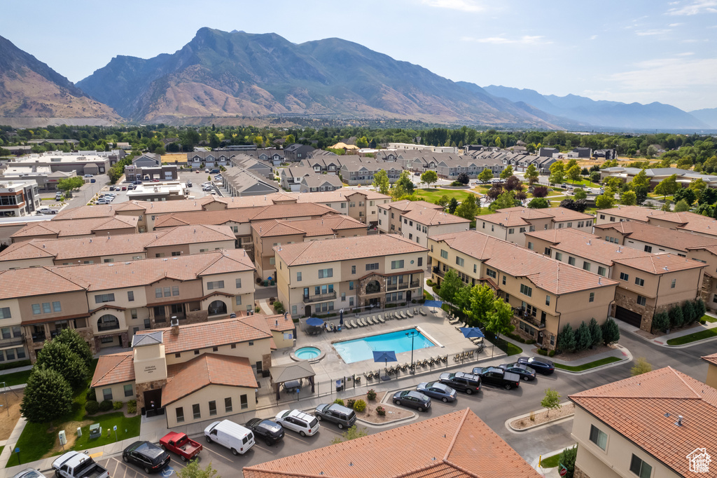 Aerial view of a pool and a mountain backdrop