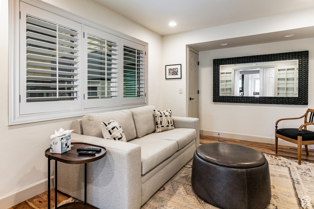 Living room with wood finished floors and recessed lighting