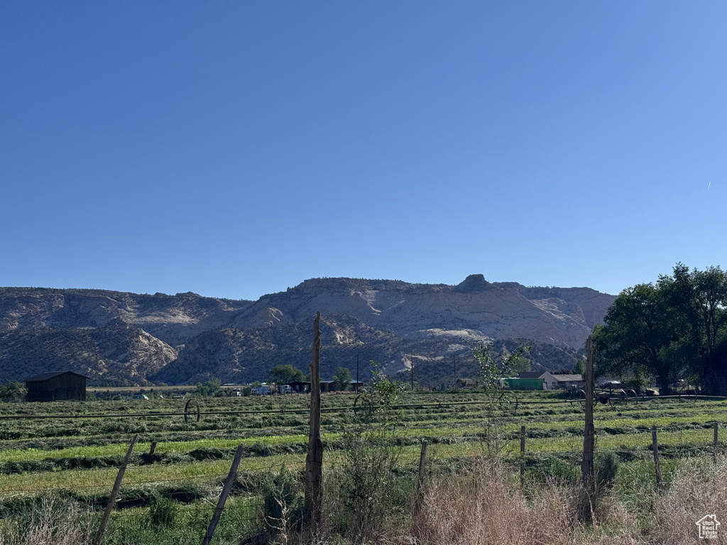View of mountain background featuring rural landscape