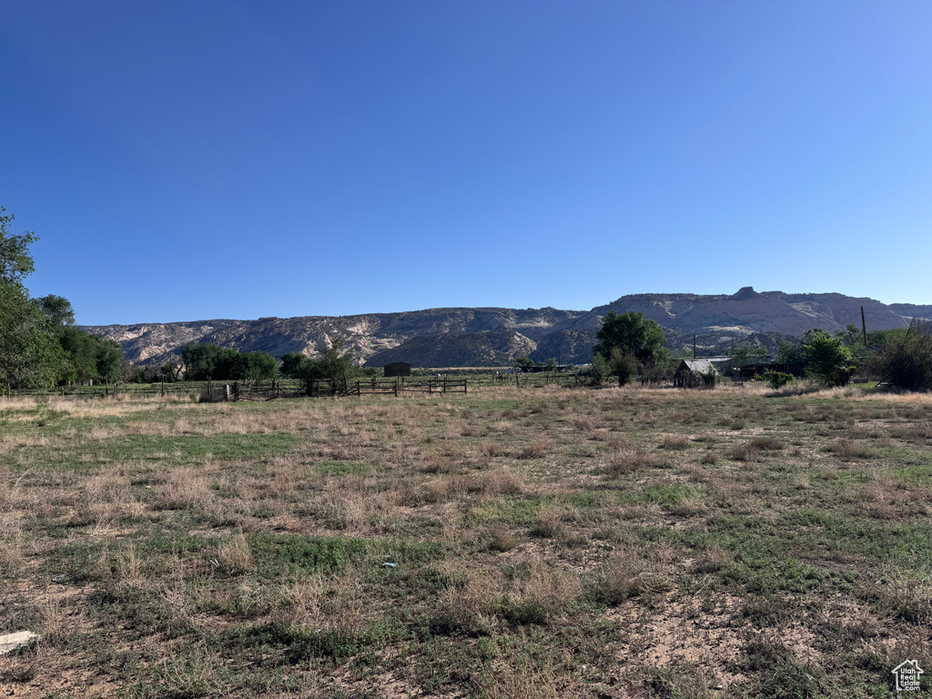 View of mountain background featuring rural landscape