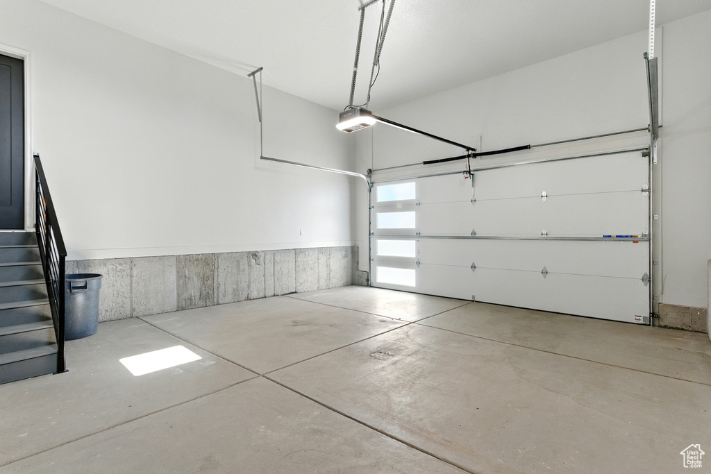 Garage featuring a garage door opener