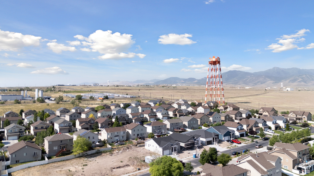 Aerial perspective of suburban area with a mountain backdrop
