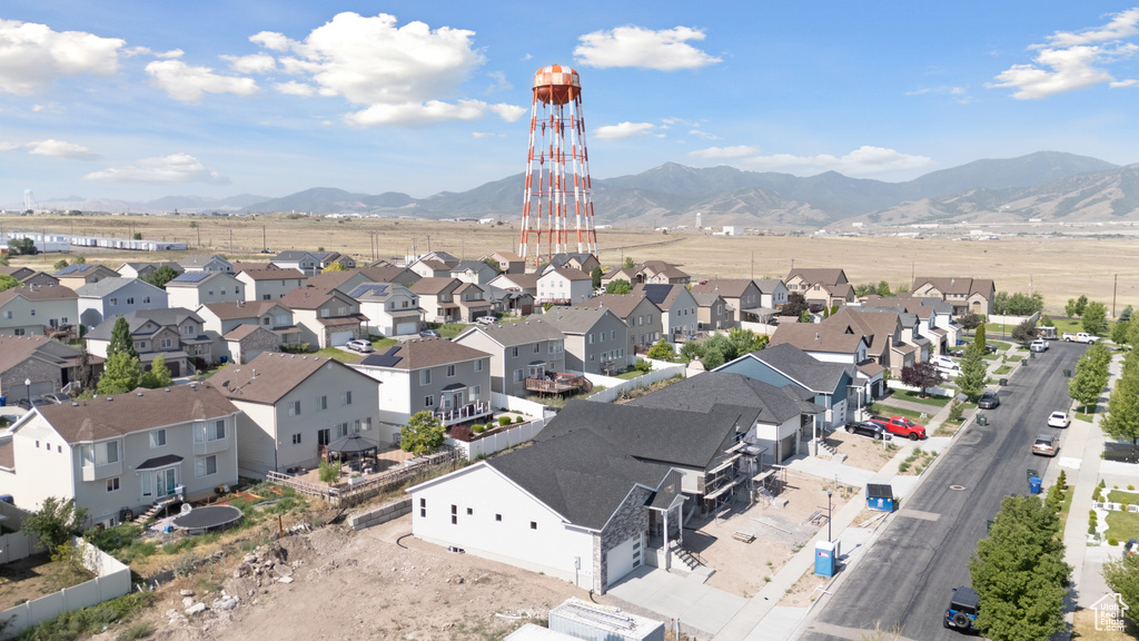 Aerial view of residential area with a mountainous background
