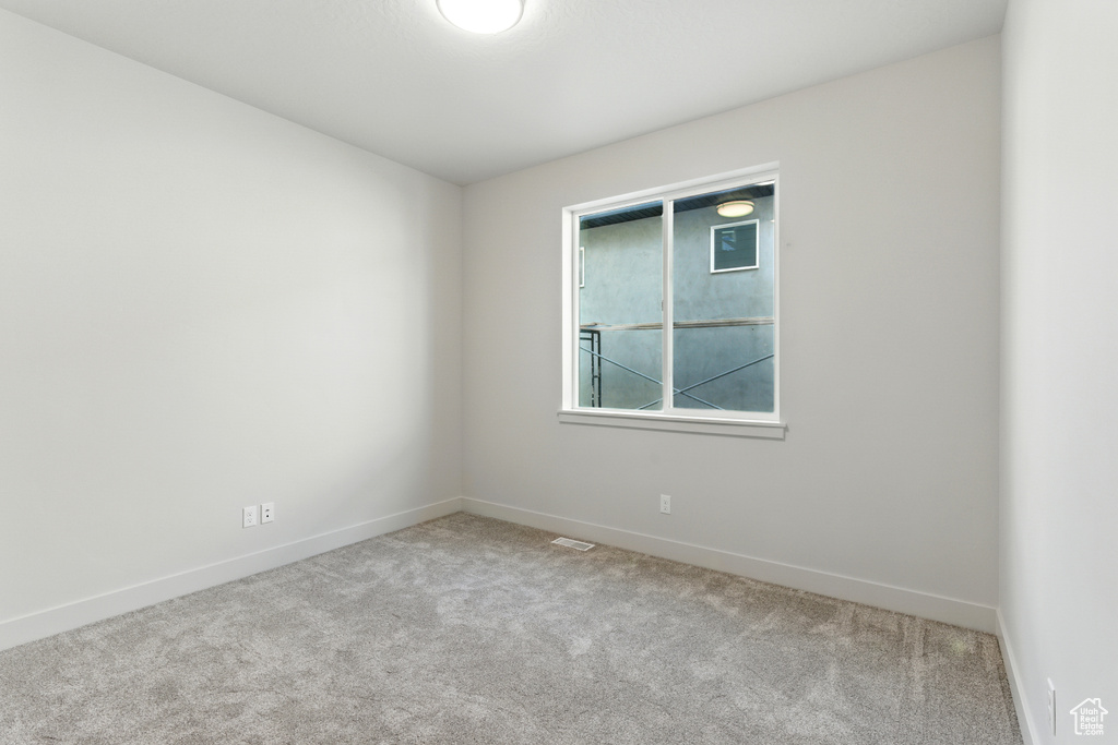 Empty room featuring carpet floors